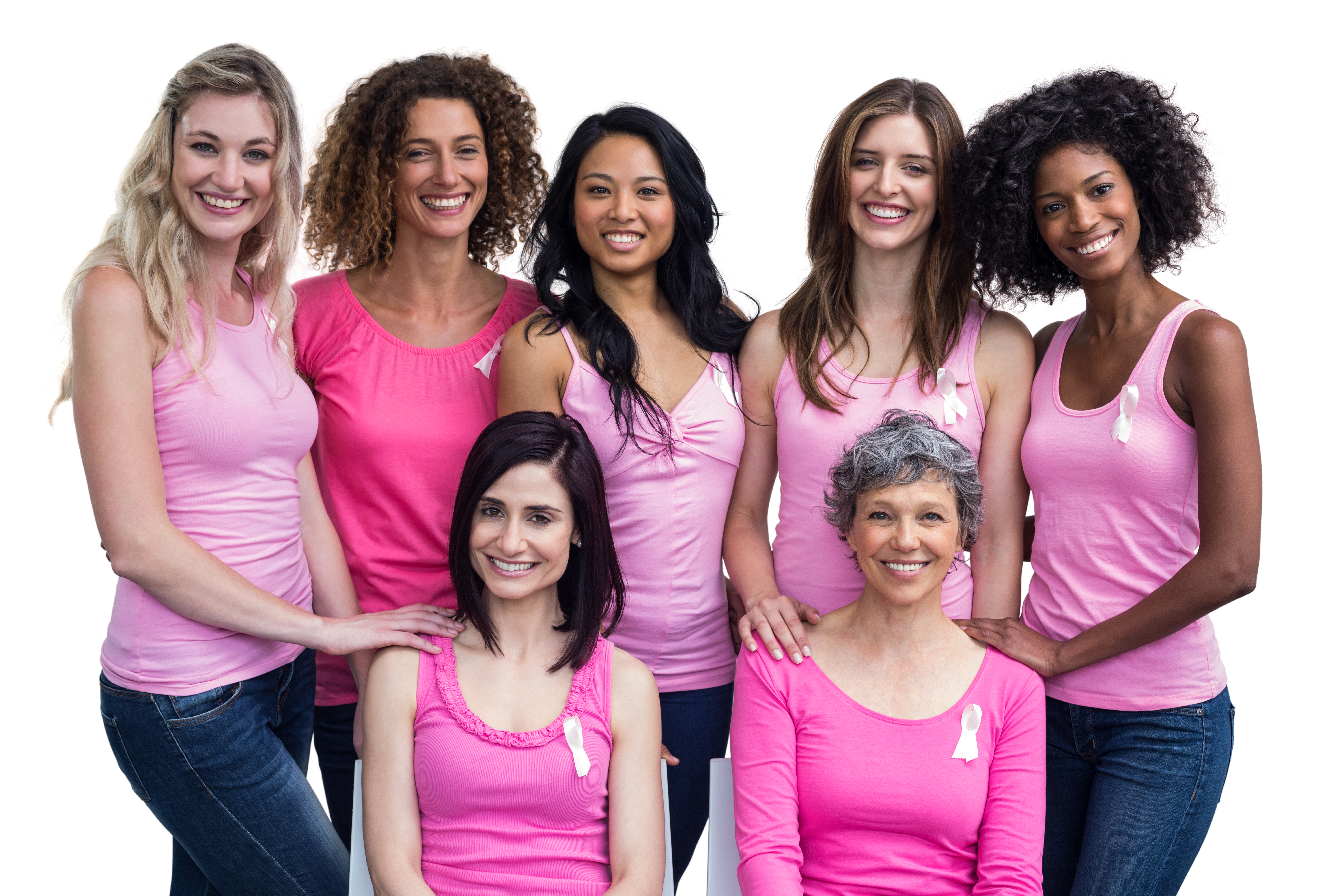 Smiling women in pink outfits posing for breast cancer awareness on white background