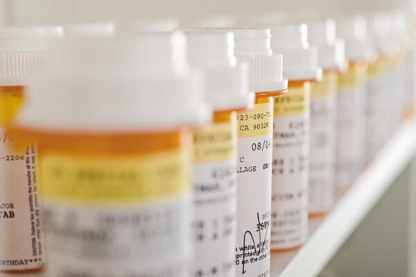 Medicine Bottles Arranged In Shelf